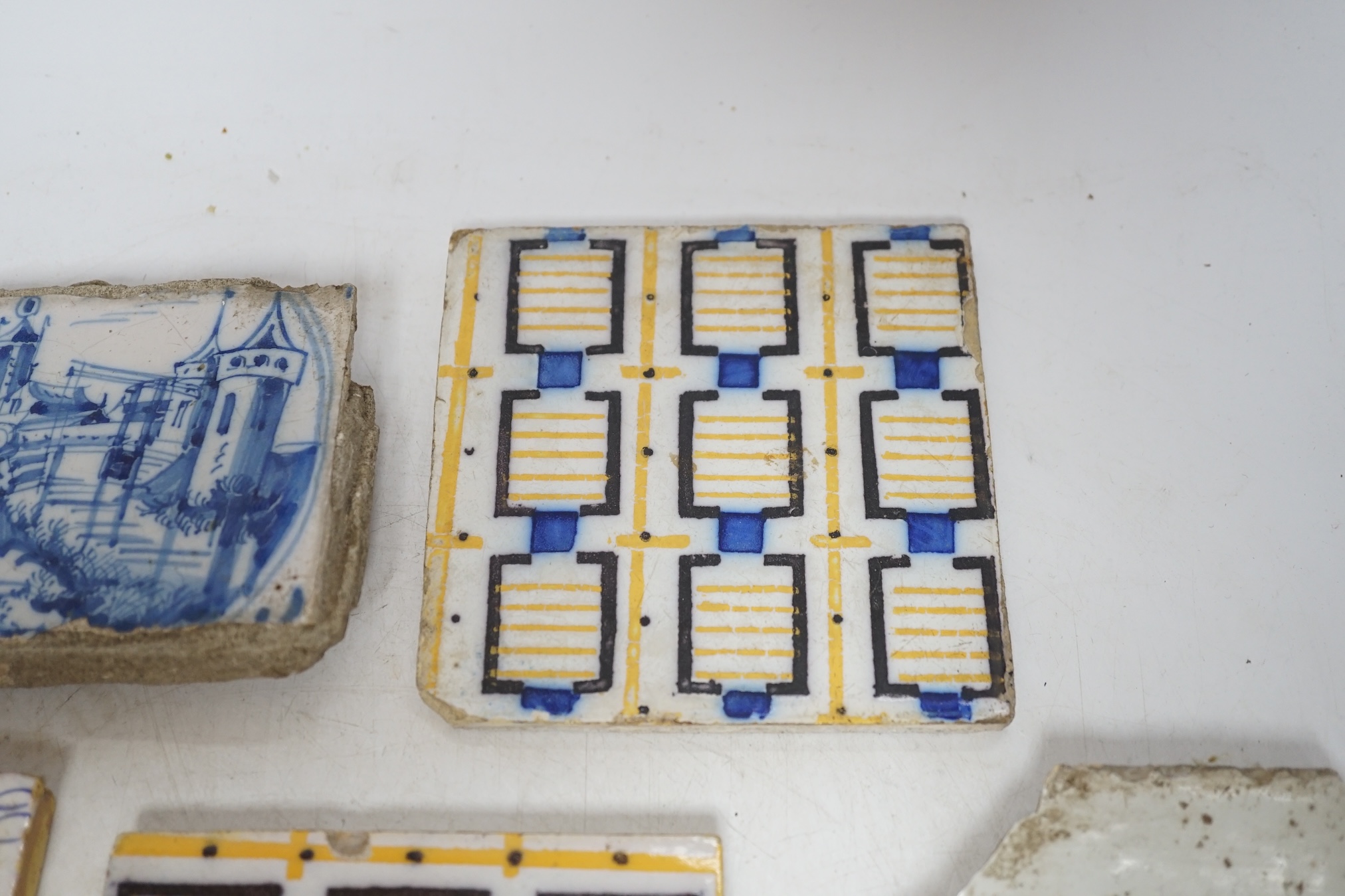 From the Studio of Fred Cuming. A group of tiles, mostly 19th / 20th century Delft, largest 23 x 23cm. Condition - fair